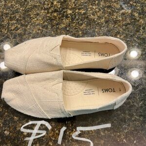 Various pairs never worn Toms
